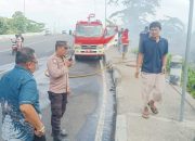 Polsek Bunaken Bersama Warga Gerak Cepat Padamkan Kebakaran Lahan di Molas