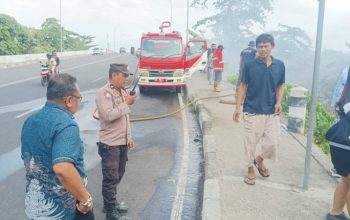 Polsek Bunaken Bersama Warga Gerak Cepat Padamkan Kebakaran Lahan di Molas